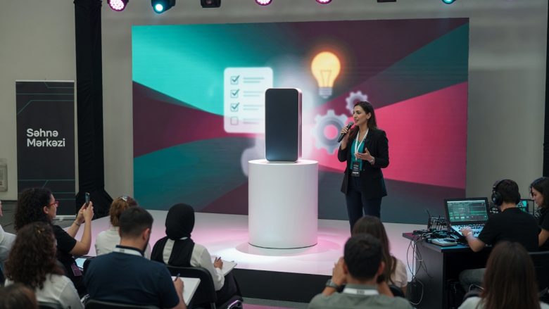 Photorealistic product launch by Səhnə Mərkəzi: presenter on a modern stage with LED graphics,